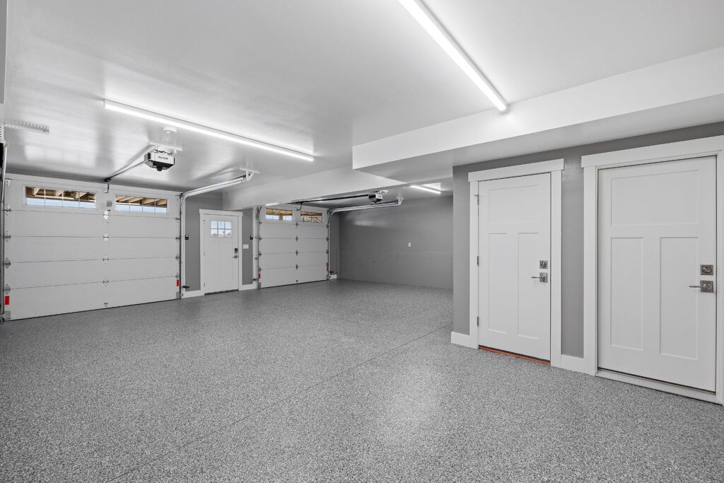 interior-view-of-an-empty-garage-with-an-epoxy-floor Garage Epoxy Flooring in Boise ID